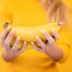 women holding banana for hair mask